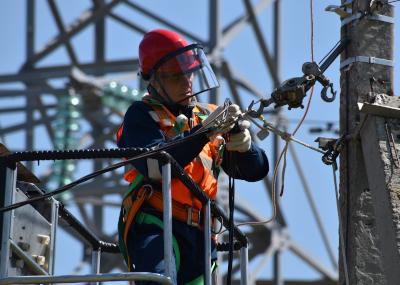 Man working on utility pole