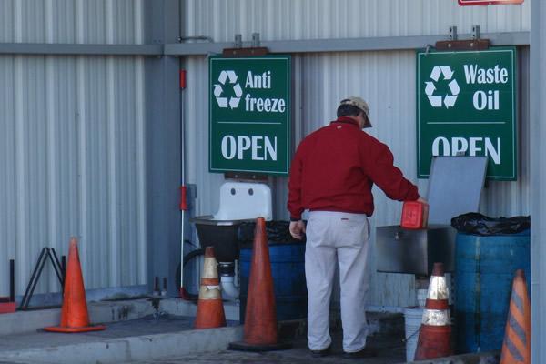 Man disposing of recycling