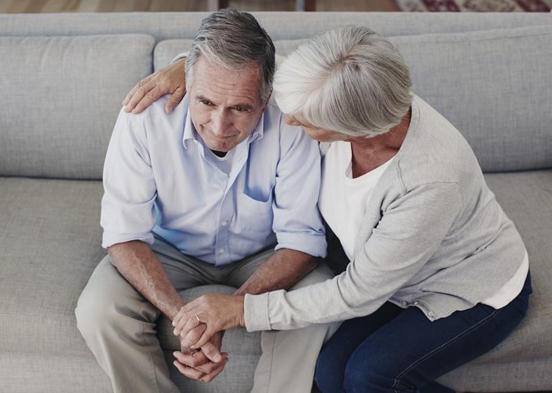 Older man being consoled