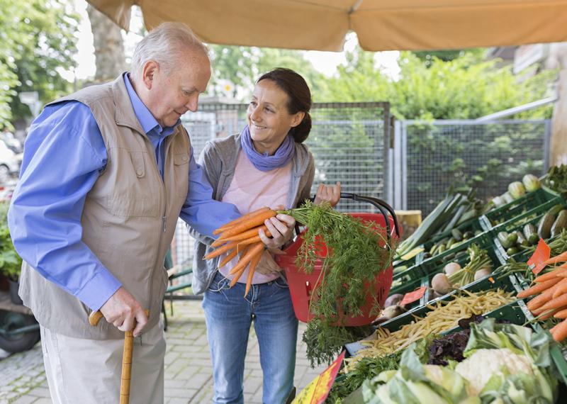 Caregiver helping older man