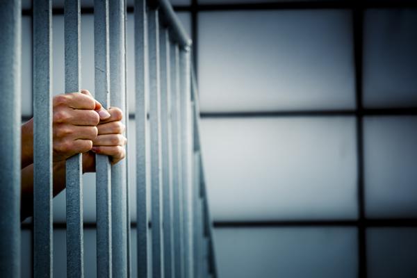 Inmate behind bars