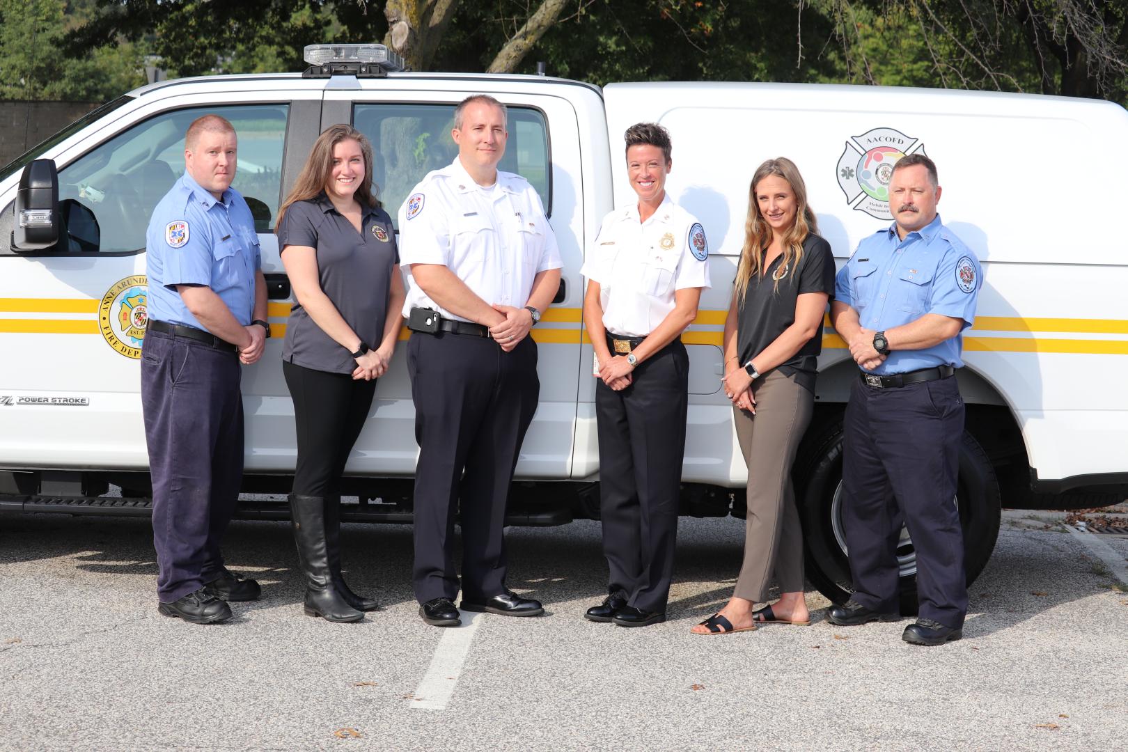 Team in front of van