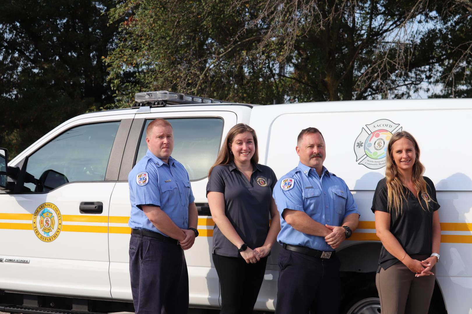 Team in front of van