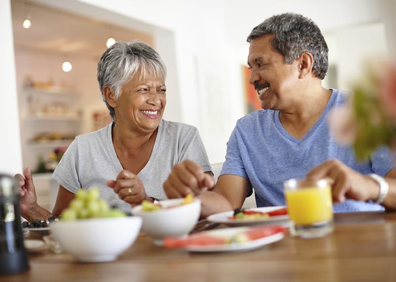 Older couple eating breakfast