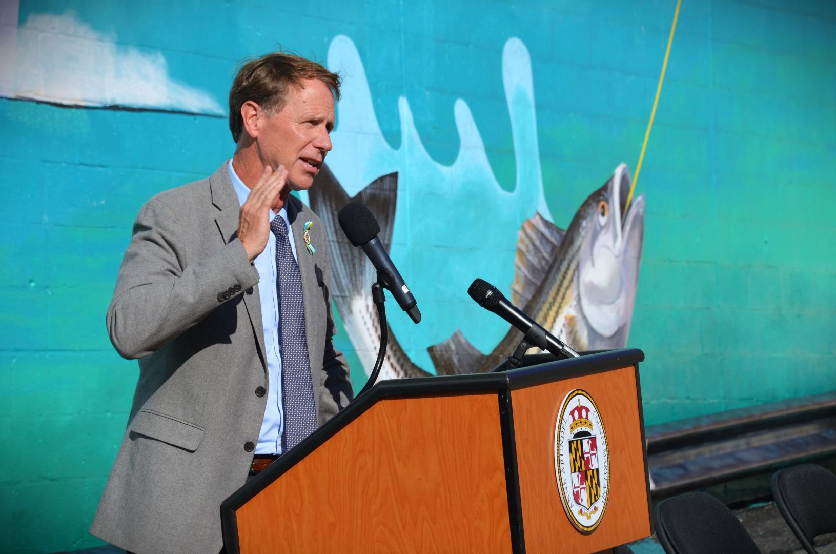 County Executive Steuart Pittman giving a speech at the podium