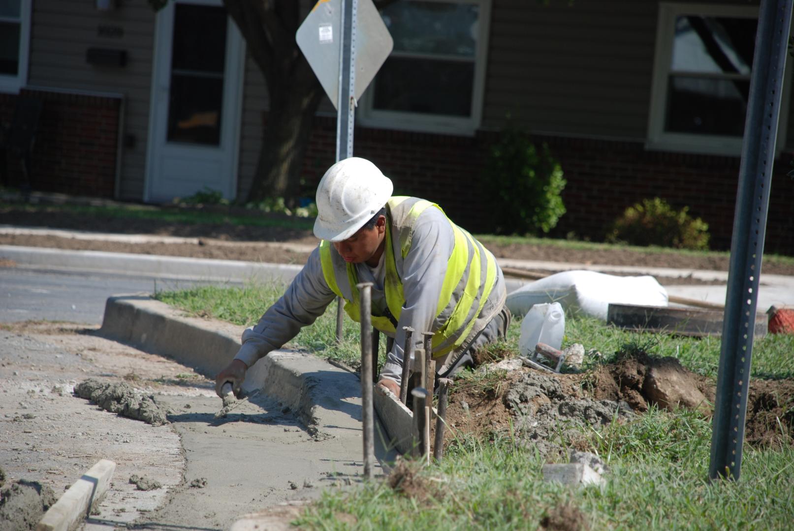 County worker building sidewalk