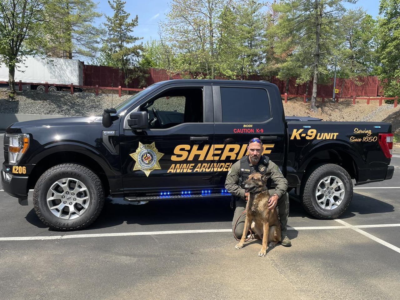 Sheriff truck with sheriff and his K-9 dog