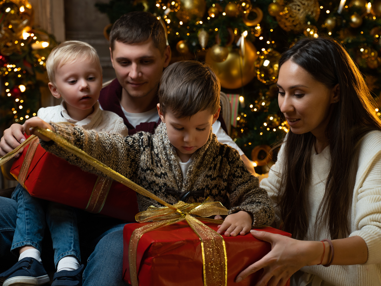 young family with holiday gifts