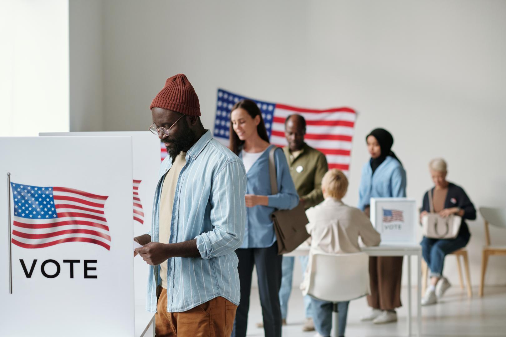 People standing in line waiting to vote