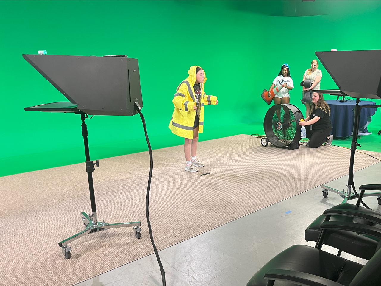 Young girl in front of green screen