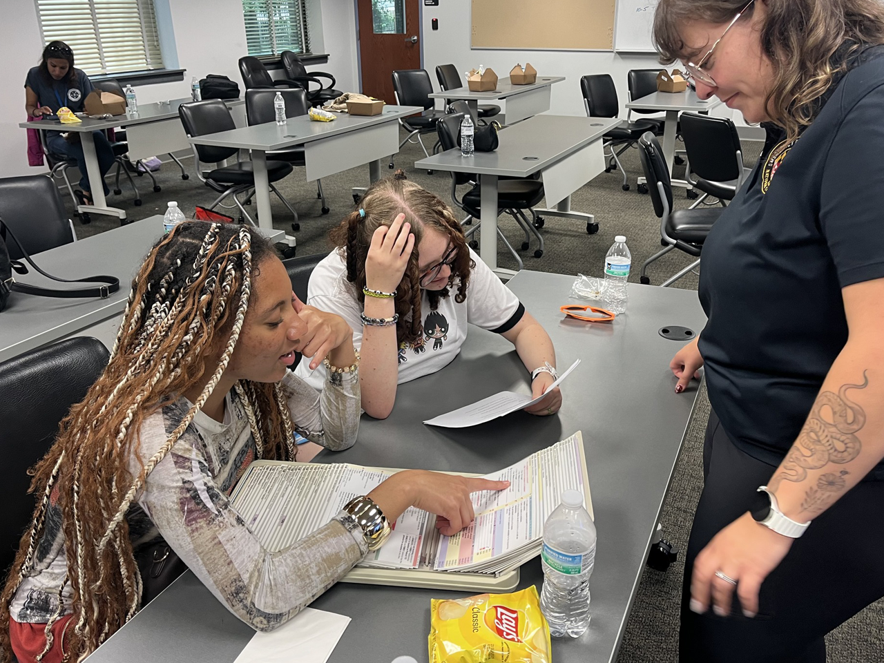 Two young girls learning with instructor