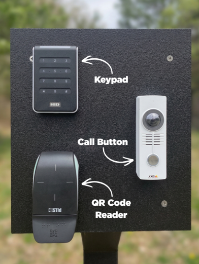 Image of the gate at the park showing keypad, call button, and qr code reader