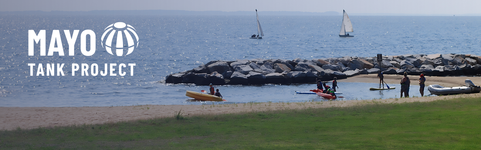 Image of Mayo Beach with people and sail boats in the water