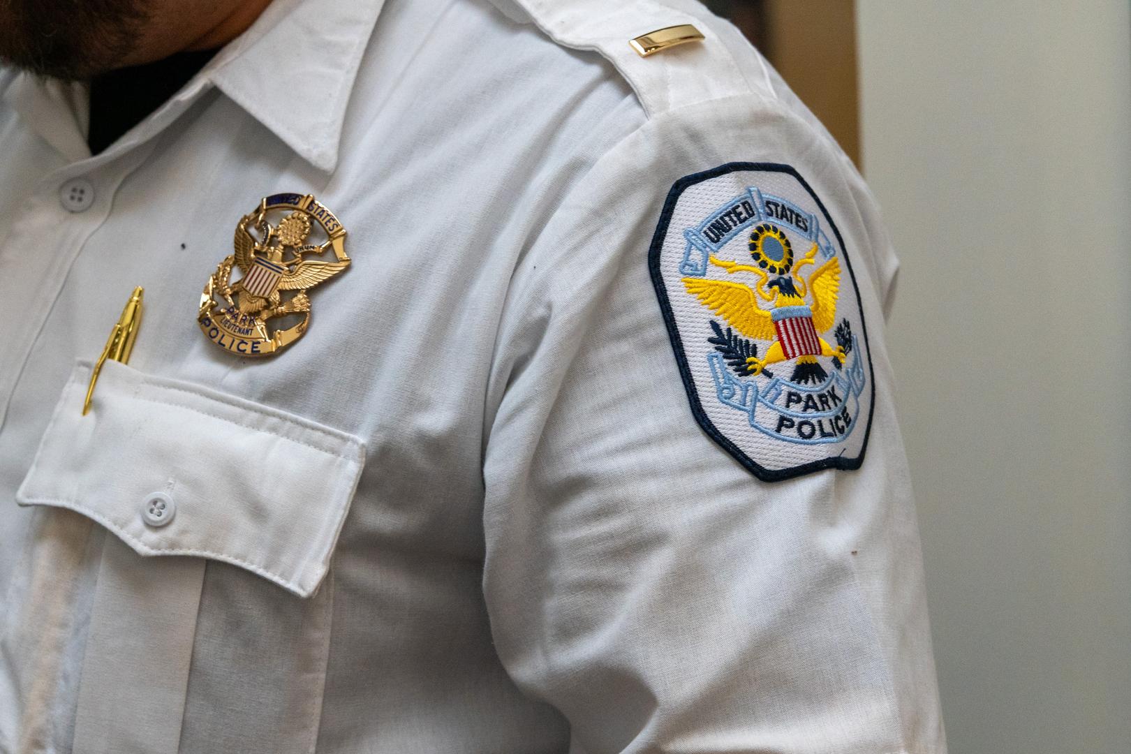 Person wearing "Park Police Badge" on left shirt arm