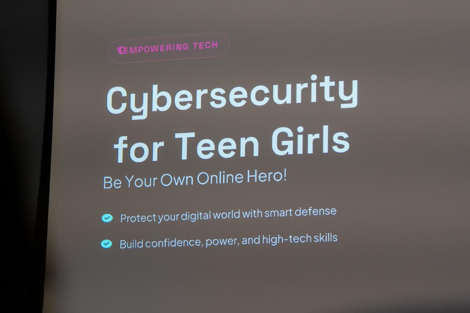 HERoes on the HERizon Camp display that says "Cybersecurity for Teen Girls"