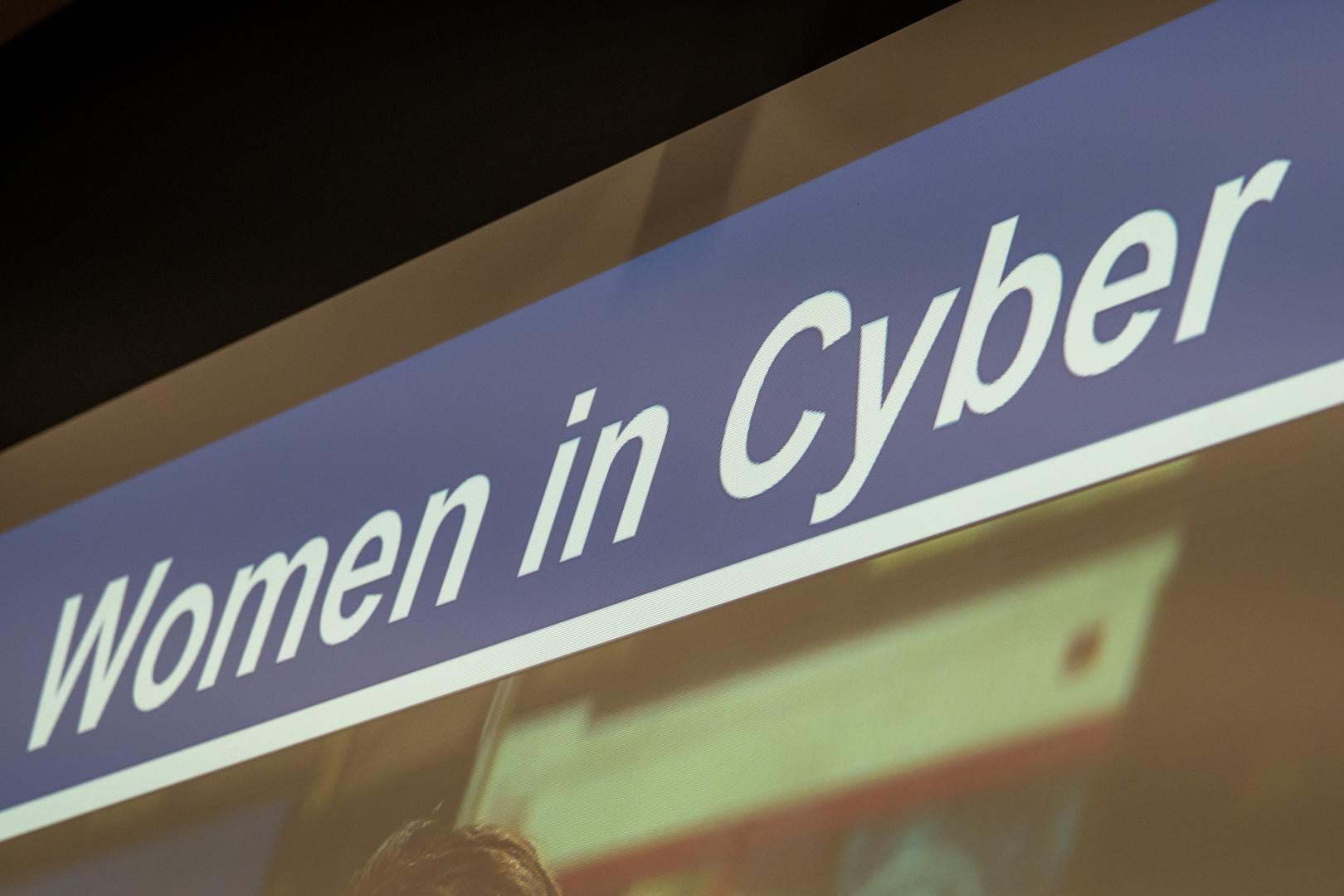 HERoes on the HERizon Camp display saying "Women in Cyber"