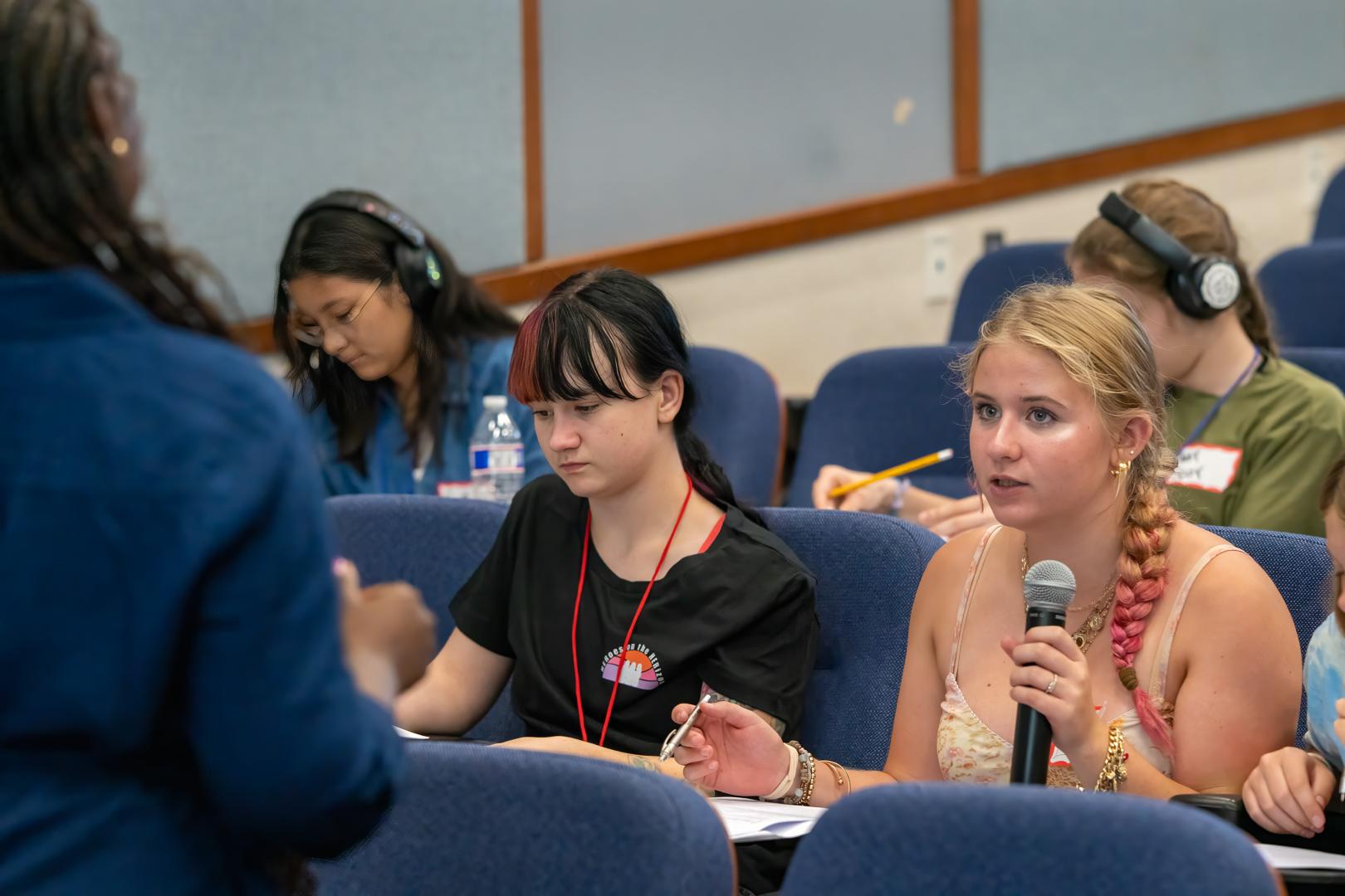 Participants in the auditorium during HERoes on the HERizon Camp 