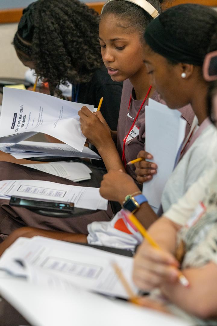 Participants taking notes during HERoes on the HERizon Camp 