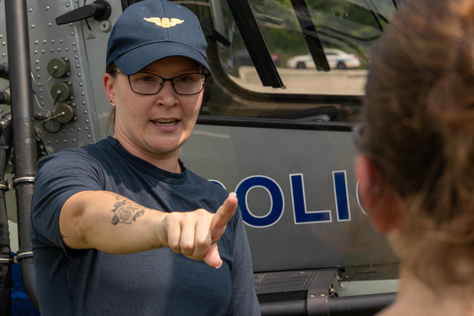 A female mentor guiding a participant through a hands-on learning activity during the HERoes on the HERizon camp.