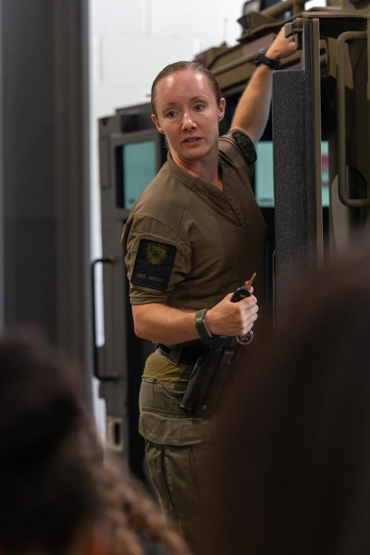 A female mentor guiding a participant through a hands-on learning activity during the HERoes on the HERizon camp.