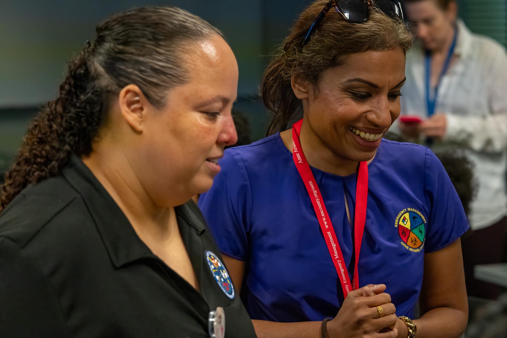 mentors guiding participants through a hands-on learning activity during the HERoes on the HERizon camp
