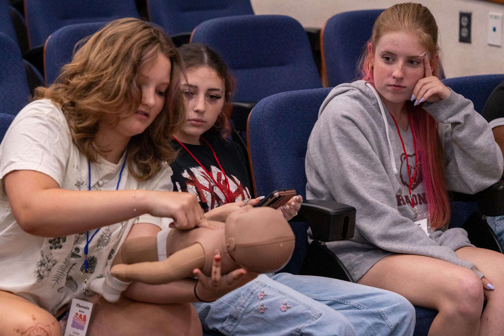 ampers collaborating on a group project during the HERoes on the HERizon youth camp.