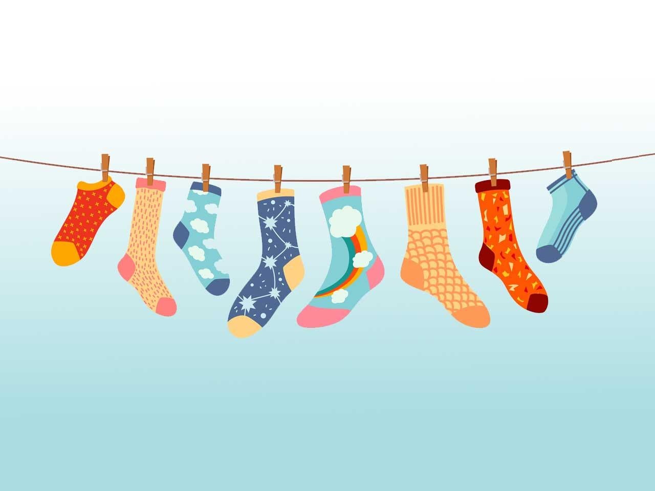 Socks on clothesline, cotton or wool socks hanging on rope with clothespins, cartoon vector. Socks laundry on line with pins, socks with color ornament pattern hanging on clothesline for kids design.